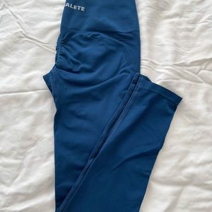 Dark blue Alphalete amplify leggings.